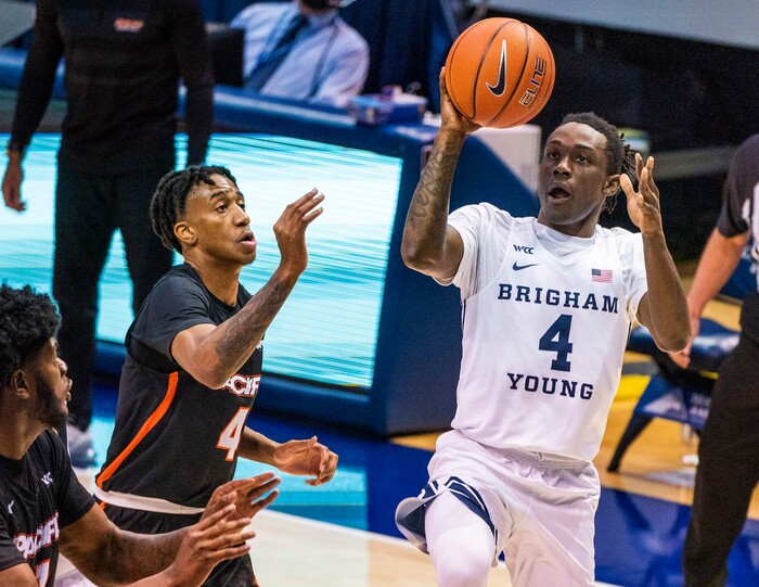 (Rick Egan | The Salt Lake Tribune) Brigham Young Cougars guard Brandon Averette (4) shoots as Pacific Tigers guard Daniss Jenkins (4) defends, in basketball action at the Marriott Center in Provo, on Saturday, Jan. 30, 2021.