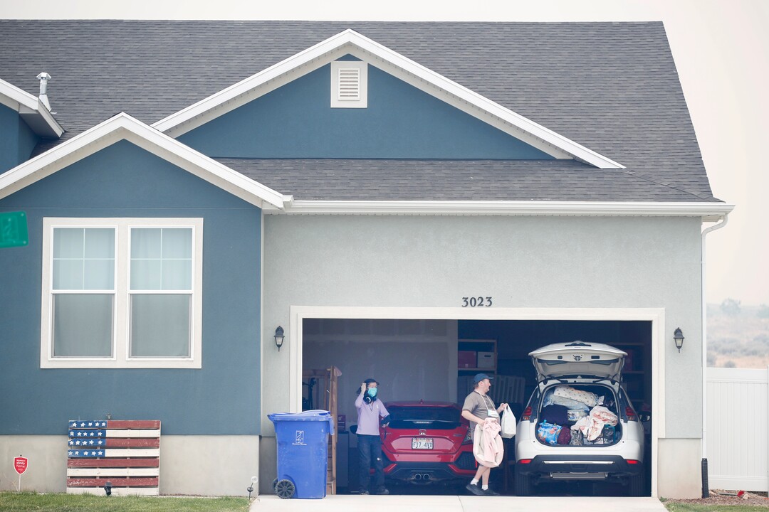 People load their cars with belongings in case they are ordered to evacuate from their home in south Saratoga Springs due to a wildfire on June 28, 2020. Photo by George Frey.