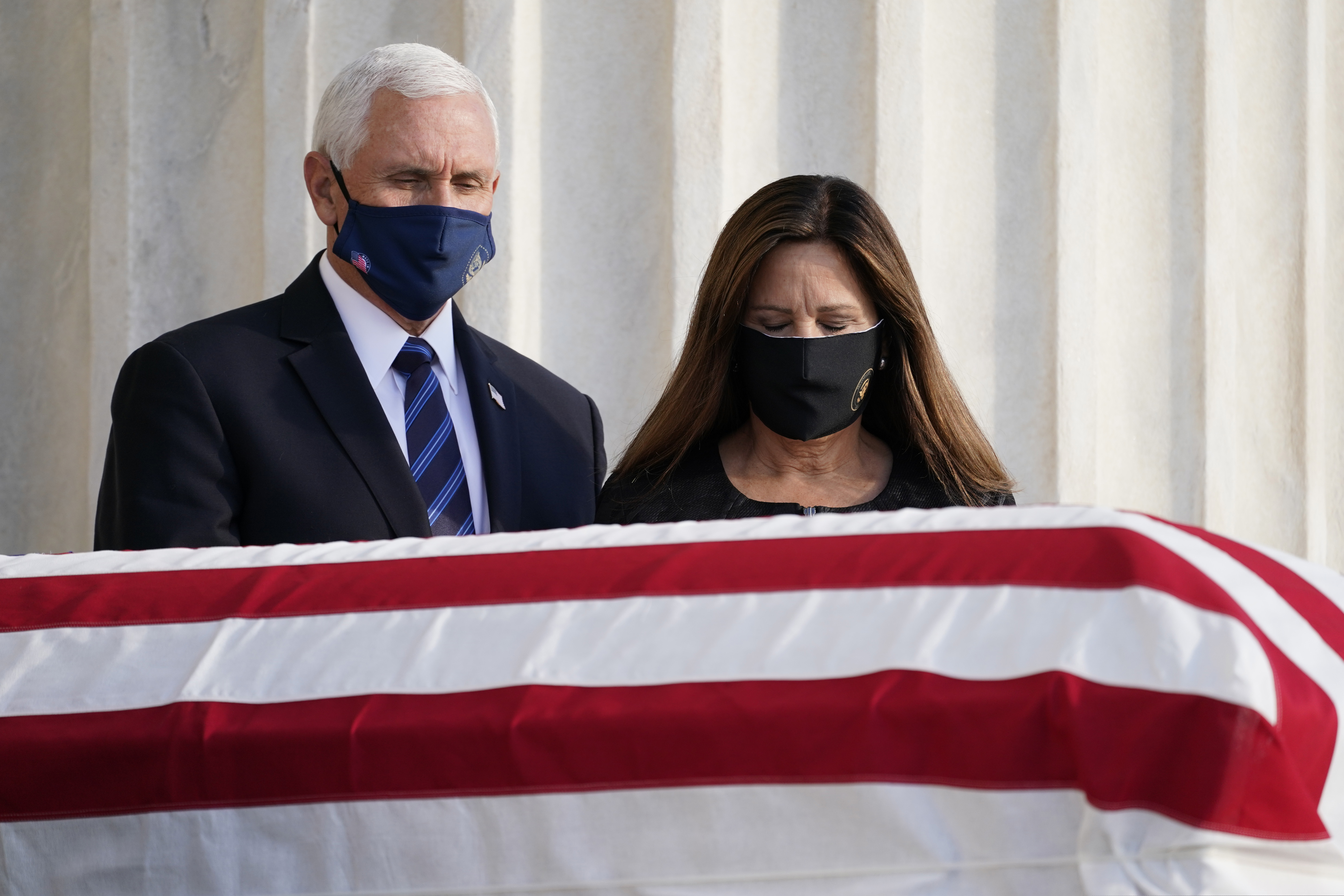 Vice President Mike Pence and second lady Karen Pence pay respects as Justice Ruth Bader Ginsburg lies in repose under the Portico at the top of the front steps of the U.S. Supreme Court building on Wednesday, Sept. 23, 2020, in Washington. Ginsburg, 87, died of cancer on Sept. 18. (AP Photo/Alex Brandon, Pool)