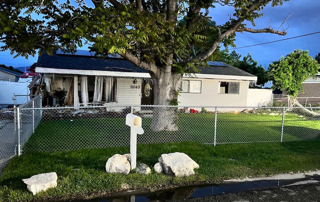 (West Valley City Police Department) A man was killed when he was struck by a stolen car allegedly driven by a 15-year-old boy on Thursday, May 25, 2023. The car also smashed into this home, police said.