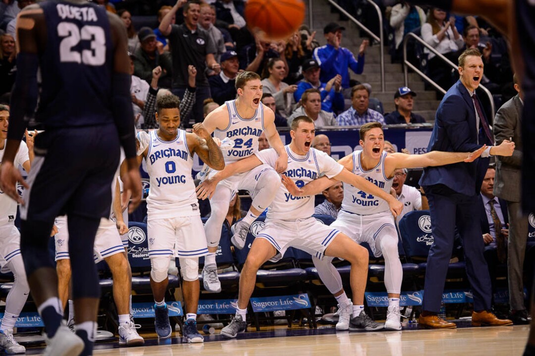 (Trent Nelson | The Salt Lake Tribune)  BYU's bench celebrates a foul as BYU hosts Utah State, NCAA basketball in Provo on Wednesday Dec. 5, 2018.