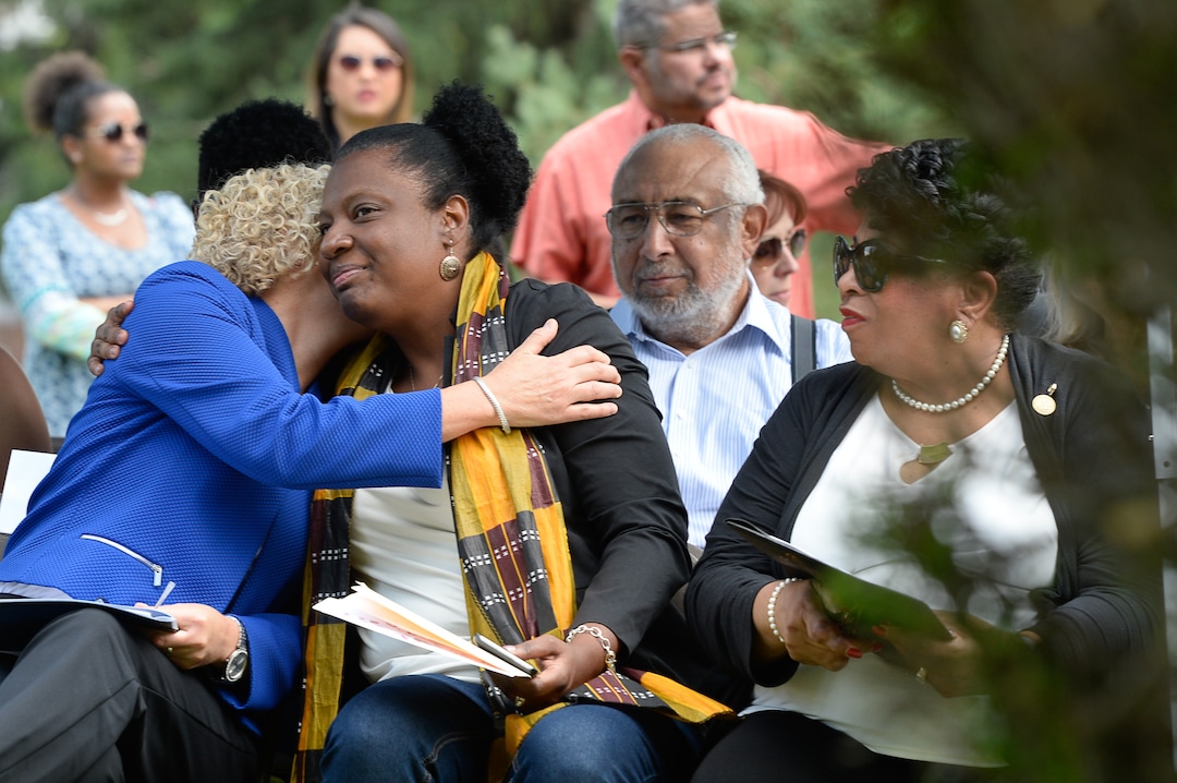 (Francisco Kjolseth  |  The Salt Lake Tribune)  Mayor Jackie Biskupski, left, embraces Rep. Sandra Hollins, D-Salt Lake, alongside Jeanetta Williams, NAACP President as they attend a grave marker dedication at the Salt Lake City Cemetery for Tom, an enslaved Black pioneer who was buried in the Salt Lake City Cemetery in 1862. The placement and dedication of the marker on Thursday, Aug. 22, 2019, is the result of research initially conducted by Mark Smith, the former sexton of the Cemetery.