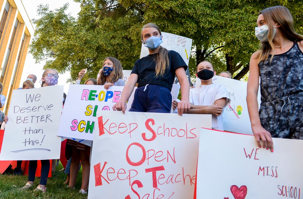 (Leah Hogsten  |  The Salt Lake Tribune) Parents and students within the Salt Lake City School District rally for K-12 students to return in-person to school this fall, July 15, 2020. 