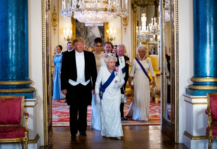 President Donald Trump and first lady Melania Trump walk with Queen Elizabeth II, followed by first lady Melania Trump, Prince Charles, and Camilla, Duchess of Cornwall, as they make their way into the Music Room for a State Banquet at Buckingham Palace, Monday, June 3, 2019, in London. (Doug Mills/Pool Photo via AP)