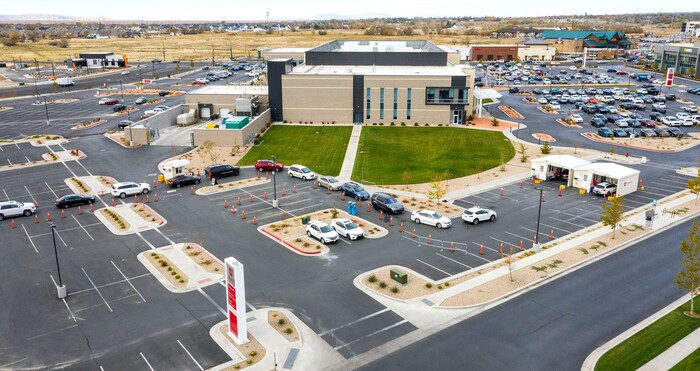 (Leah Hogsten  |  The Salt Lake Tribune) A line of cars bends around the University Of Utah Hospital's parking lot as people wait for COVID-19 testing in Farmington, Oct. 23, 2020.