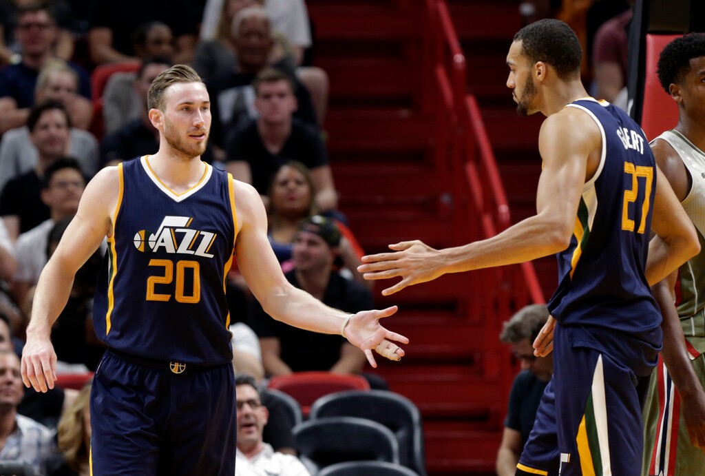 Utah Jazz's Gordon Hayward (20) is congratulated by Rudy Gobert (27) after drawing a foul during the second half of an NBA basketball game against the Miami Heat, Saturday, Nov. 12, 2016, in Miami. (AP Photo/Lynne Sladky)
