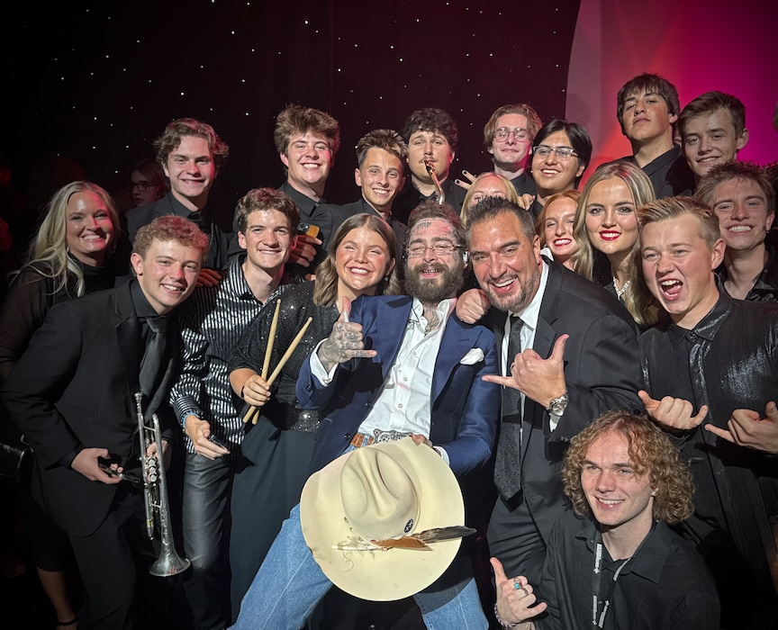 (Caleb Chapman's Crescent Super Band) Caleb Chapman's Crescent Super Band performing alongside Post Malone at an Eccles Theater benefit concert in October 2025. The Pleasant Grove-based band is set to represent Utah at the National Mall as part of America's 250th birthday celebrations. 