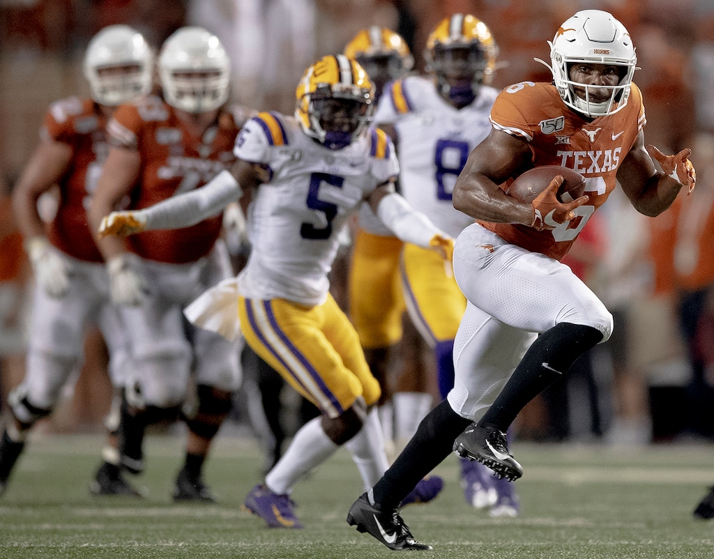 (Nick Wagner | American-Statesman via AP) Texas receiver Devin Duvernay (6) runs for a touchdown against LSU in September, when he caught 12 passes for 154 yards and two scores against the Tigers.