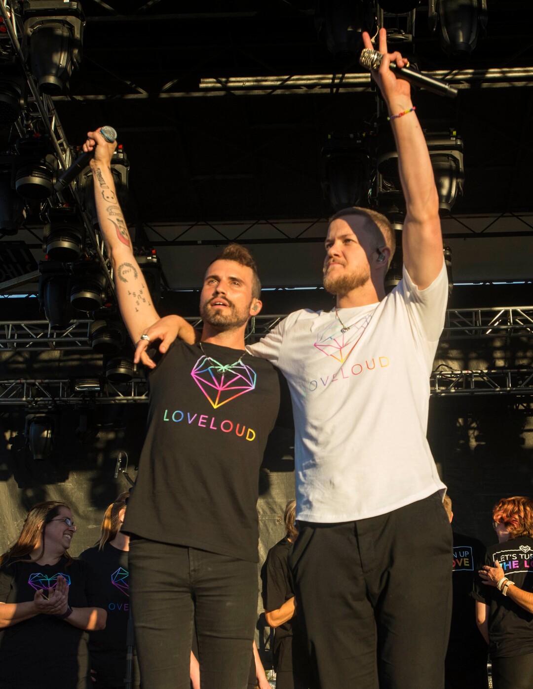(Rick Egan  |  The Salt Lake Tribune)  Tyler Glenn, Neon Trees, and Dan Reynolds, Imagine Dragons wave to the crowd, after performing a song together, at the LoveLoud Festival at Brent Brown Ballpark at UVU campus, Saturday, August 26, 2017.