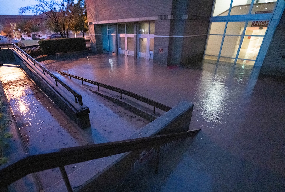 (Francisco Kjolseth | The Salt Lake Tribune) One of the entrances to East High is severely flooded, with doors and windows partially holding back deep water following a torrential downpour on Sunday, Aug. 1, 2021.