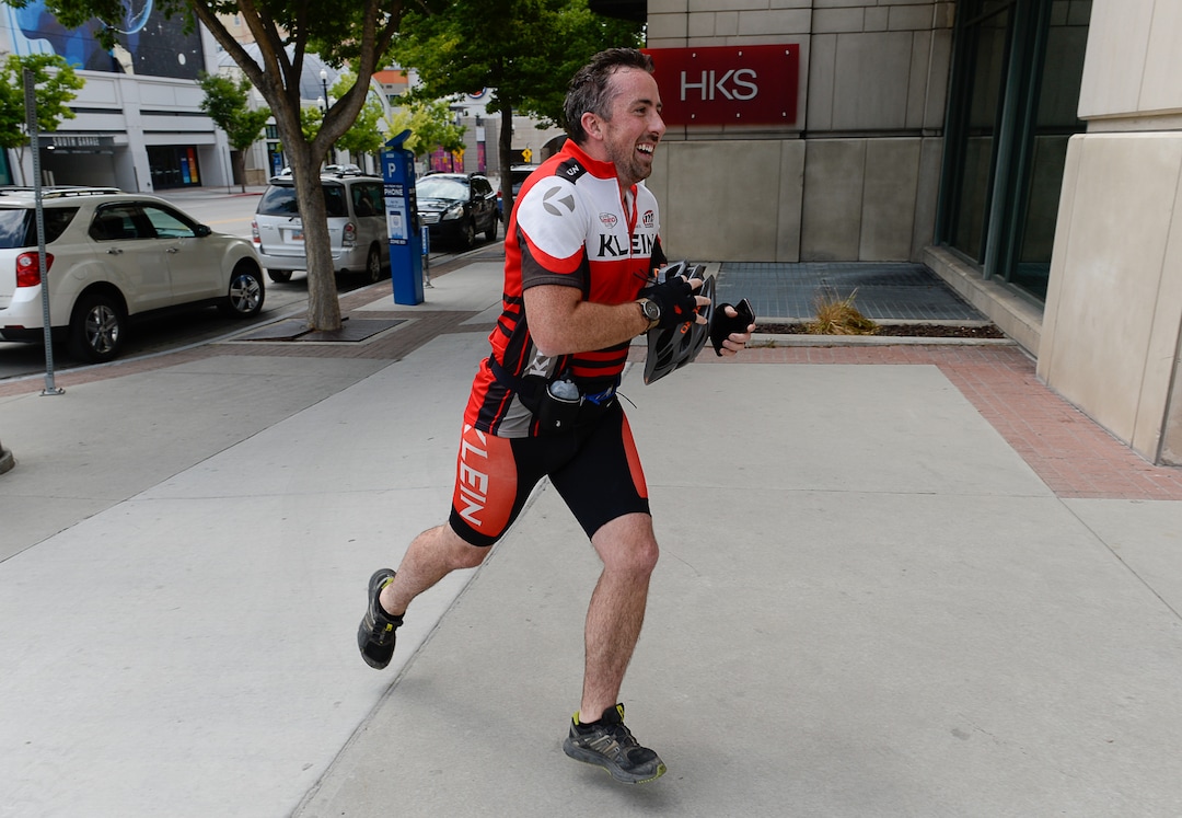 (Francisco Kjolseth  |  The Salt Lake Tribune)  Salt Lake Tribune reporter Ben Wood runs the last leg of his race against colleagues during a downtown transportation race from Library Square to the Tribune building at the Gateway on Thursday, Aug. 2, 2018, after docking his Green Bike. Modes of transportation included, rentable electric scooters, Green Bike, TRAX, Lyft, and walking.