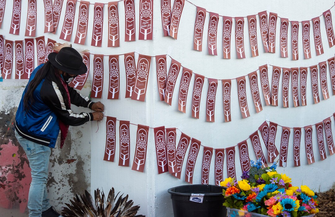 (Rick Egan  |  The Salt Lake Tribune)    Carl Moore arranges names of murdere3d and missing indigenous women and girls, at the Indigenous Peoples Day celebration, on Monday, Oct. 12, 2020.
