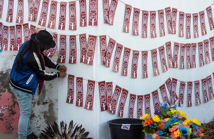 (Rick Egan  |  The Salt Lake Tribune)    Carl Moore arranges names of murdere3d and missing indigenous women and girls, at the Indigenous Peoples Day celebration, on Monday, Oct. 12, 2020.