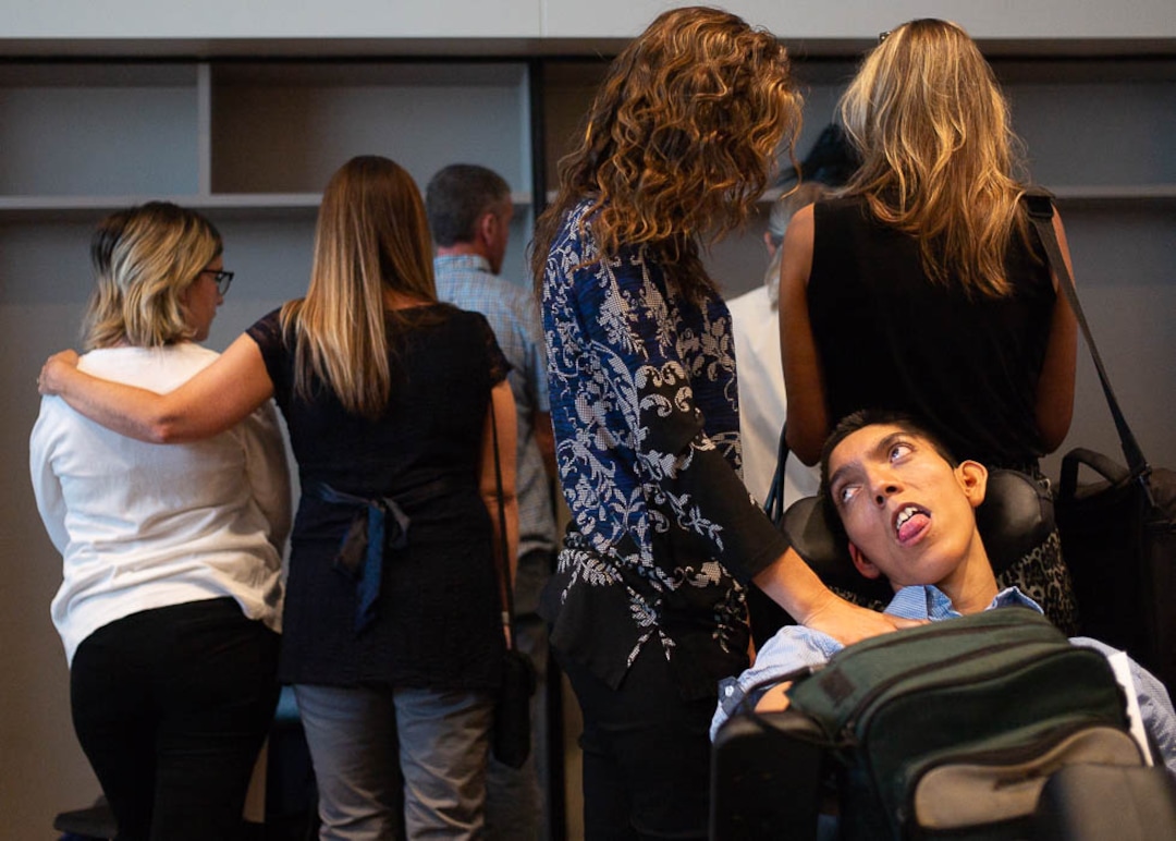 (Trent Nelson | The Salt Lake Tribune)  Protestors turn their back on a news conference where a coalition including the LDS Church came out against Utah's medical marijuana initiative, in Salt Lake City on Thursday Aug. 23, 2018.