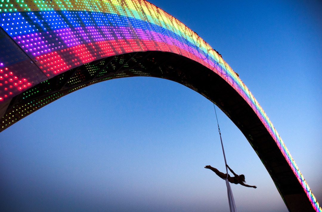 (Rick Egan  |  The Salt Lake Tribune)   Jennifer Alverado, from San Francisco, performs aerial acrobatics, suspended from the Rainbow Bridge, by San Francisco artist Josh Zubkoff, at Burning Man, during Burning Man, a week long celebration of art and radical self expression, in the Black Rock Desert in Nevada, Saturday, Sept. 1, 2018.
