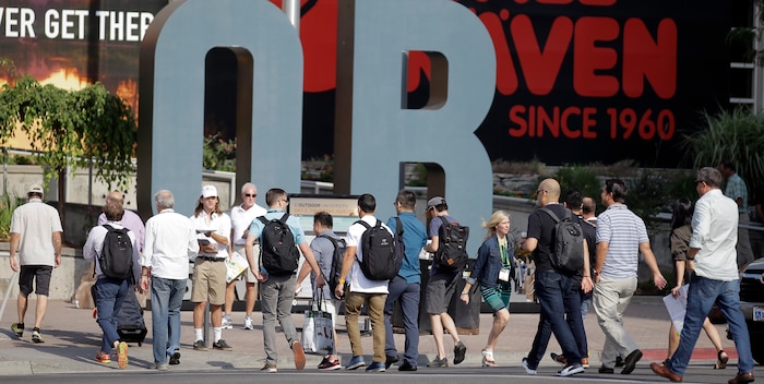 People attend the Outdoor Retailer show Thursday, Aug. 4, 2016, in Salt Lake City. Thousands of people are expected in Salt Lake City this week to take part in the world's largest outdoor retail show that comes twice a year to Utah. The Outdoor Retailer show allows store owners to meet with manufacturers and suppliers to preview new products. (AP Photo/Rick Bowmer)