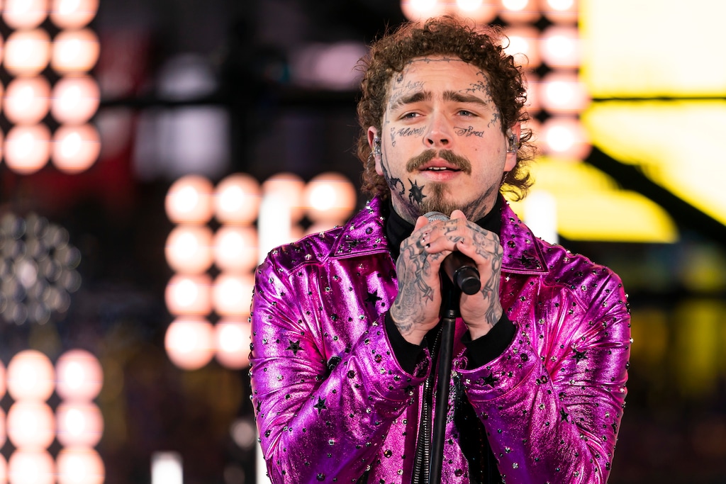 FILE - This Tuesday, Dec. 31, 2019, file photo shows Post Malone performing at the Times Square New Year's Eve celebration in New York. Post Malone is the sunflower of the 2020 Billboard Music Awards. The multi-platinum 25-year-old star scored 16 nominations, dick clark productions and NBC announced Tuesday, Sept. 22, 2020. Malone’s nominations include top artist, top male artist, top rap artist and top streaming songs artist. (Photo by Ben Hider/Invision/AP, File)