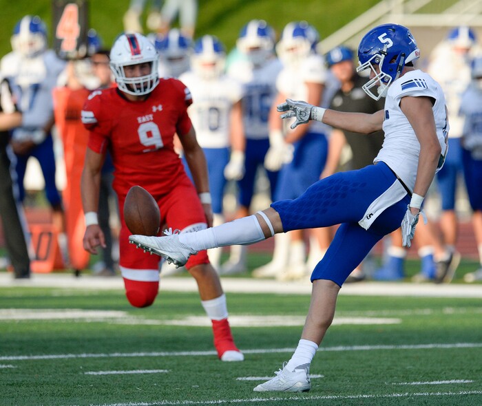 (Francisco Kjolseth  |  The Salt Lake Tribune)  John Paul of Bingham gets rid of the ball before Addison Trupp of East is able to force a block at East on Friday, Aug. 24, 2018.