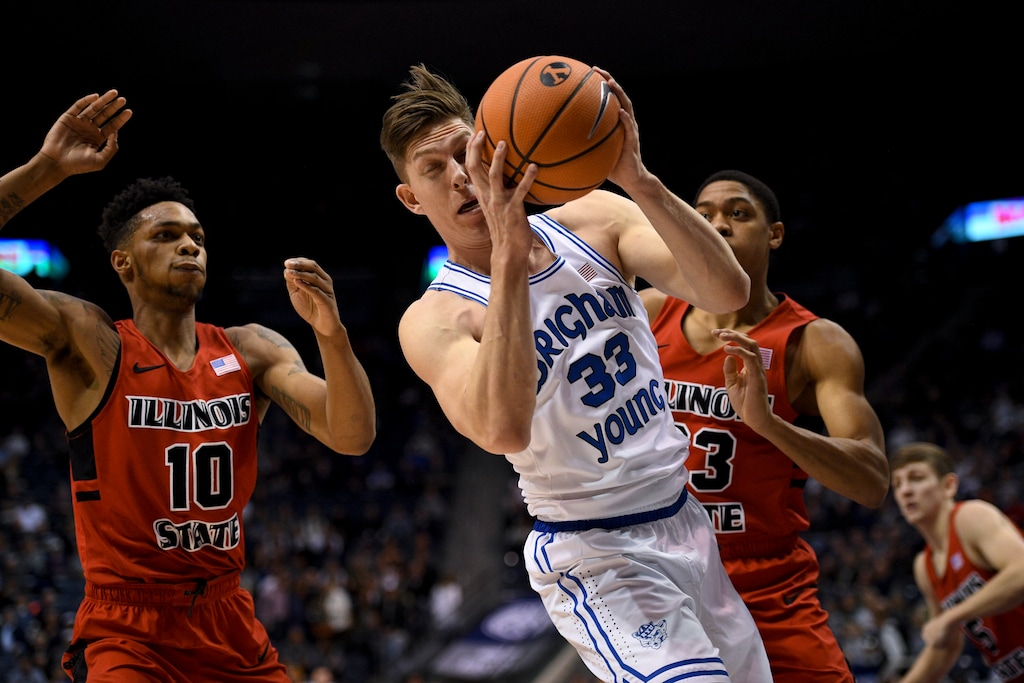BYU forward Dalton Nixon (33) snags a rebound from Illinois State forward Phil Fayne (10) and guard William Tinsley (23) during an NCAA college basketball game Wednesday, Dec. 6, 2017, in Provo, Utah. (Isaac Hale/The Daily Herald via AP)