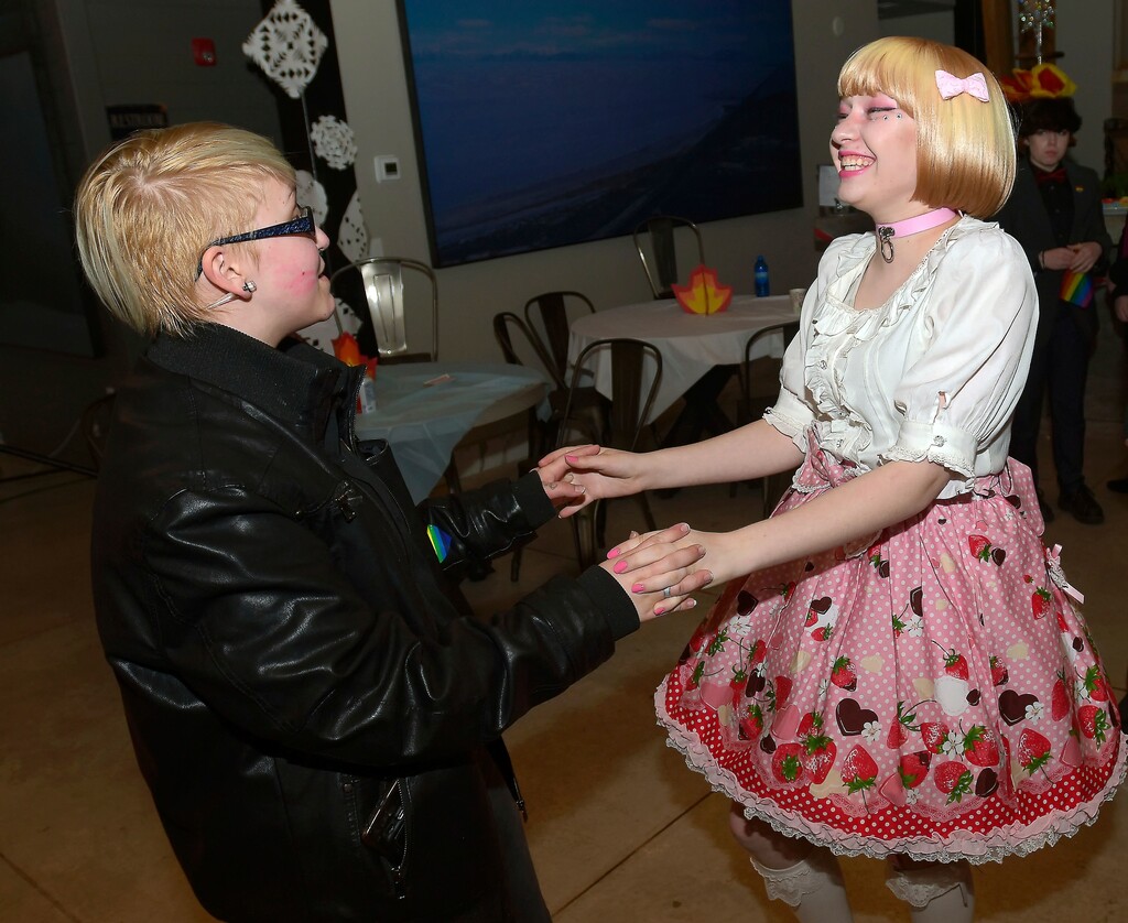 (Eli Lucero/The Herald Journal via AP) In this Saturday, May 12, 2018, photo, Spencer Guittar, left, dances with Oliver Wesley at a queer prom in Logan, Utah. The second annual alternative prom in Logan designed to make LGBTQ students feel comfortable is being organized by teenagers this time and will be called Queer Prom, the Herald-Journal reports.