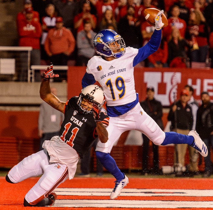 (Trent Nelson | The Salt Lake Tribune) San Jose State Spartans cornerback Dakari Monroe (19) knocks the ball away from Utah Utes wide receiver Raelon Singleton (11) as the Utah Utes host the San Jose State Spartans, NCAA football at Rice-Eccles Stadium in Salt Lake City, Saturday September 16, 2017.