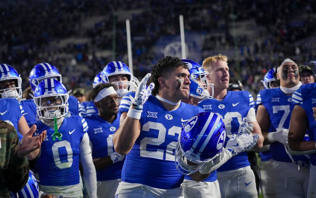 (Bethany Baker | The Salt Lake Tribune) Brigham Young Cougars sing with their fans after the loss against the Kansas Jayhawks in Provo on Sunday, Nov. 17, 2024.