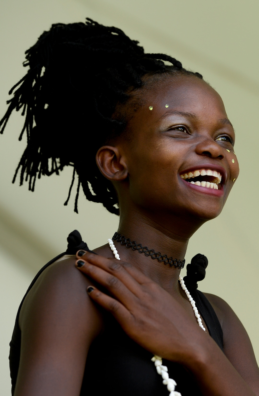 (Leah Hogsten  |  The Salt Lake Tribune) From left: Judith Gangnon, a dancer with Siphya Dance Group, laughs at the antics of her fellow dancers during the 4th Annual African Festival sponsored by the United Africans of Utah, Saturday, July 27, 2019 at Liberty Park. The African Festival promotes African tradition, culture and heritage through the arts, food fashion, music and dance.