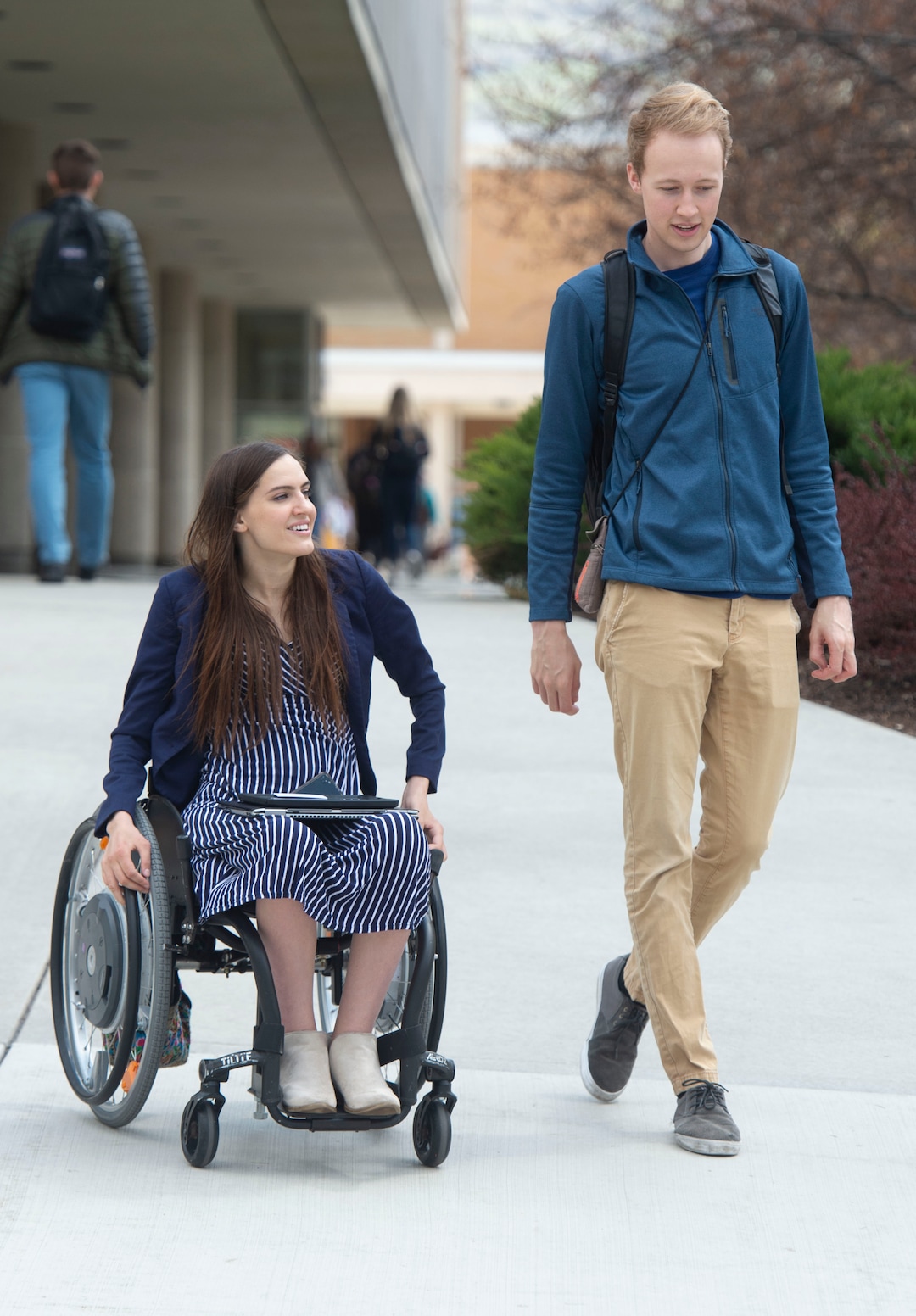 (Rick Egan  |  The Salt Lake Tribune)     Kendra Muller and Topher Taylor on take the long way to class, so Kendra can avoid the stairs on BYU campus in Provo.  The couple are challenging how BYU accommodates students with disabilities. Wednesday, April 17, 2019.