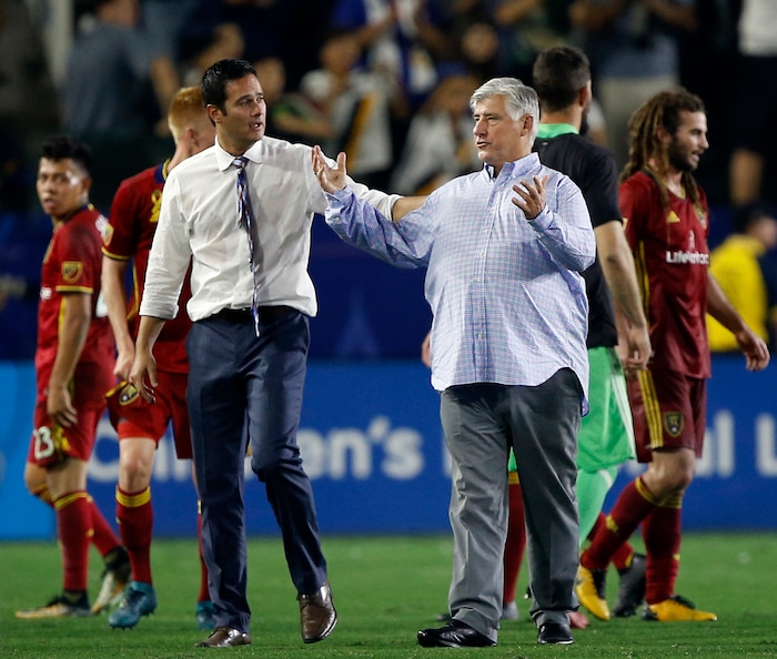 Los Angeles Galaxy coach Siegfried Schmid, center right, talks with Real Salt Lake coach Mike Petke after the teams tied, 1-1, during an MLS soccer game in Carson, Calif., Saturday, Sept. 30, 2017. (AP Photo/Alex Gallardo)