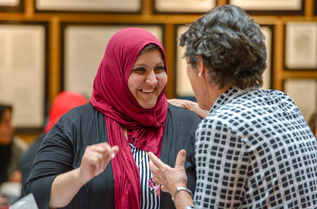 (Leah Hogsten | The Salt Lake Tribune) The Women Of The World's "Mother of the Year" award was given to Rzan Abdul Bari (left) who is congratulated by a Women of the World volunteer and supporter Jan Nelson at the banquet in Salt Lake City, Saturday, May 12, 2018. Women of the World awards its "Mother of the Year" to a woman that is fighting for her future, her childrenâ opportunities, and standing together with other refugee women.