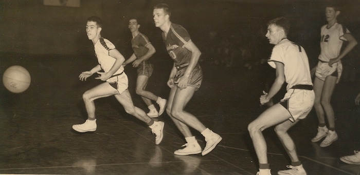 (Photo courtesy of the Hundley family) Hot Rod Hundley (center) in action for Charleston High School in West Virginia.