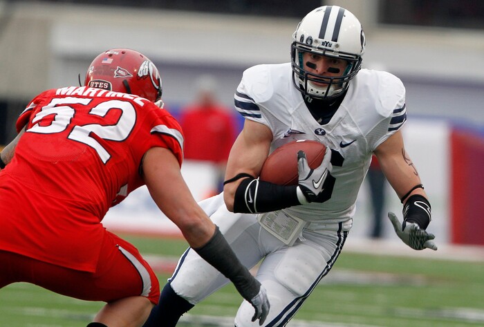 BYU wide receiver McKay Jacobson, right, can't get away from Utah linebacker Matt Martinez (52) during the first half of an NCAA college football game Saturday, Nov. 27, 2010, in Salt Lake City. (AP Photo/Jim Urquhart)
