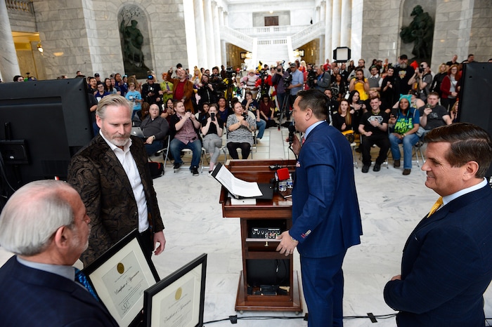 (Scott Sommerdorf | The Salt Lake Tribune) FanX Salt Lake Comic Convention co-founders Dan Farr, left, and Bryan Brandenburg are given commendations by Utah Attorney General Sean Reyes in the Utah Capitol Rotunda, Wednesday, April 11, 2018.