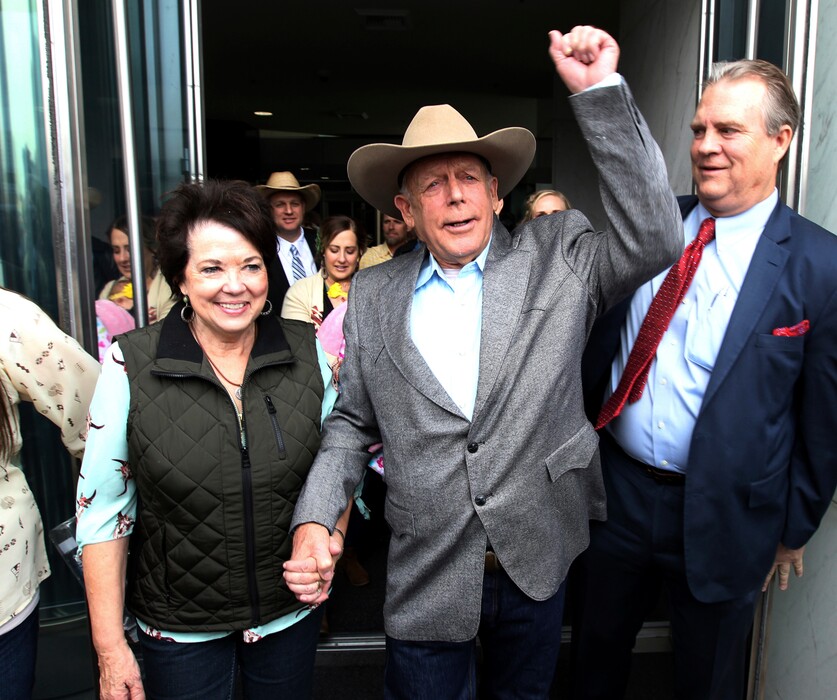(K.M. Cannon |Las Vegas Review-Journal | The Associated Press) Cliven Bundy walks out of federal court with his wife Carol on Monday, Jan. 8, 2018, in Las Vegas, after a judge dismissed criminal charges against him and his sons accused of leading an armed uprising against federal authorities in 2014.