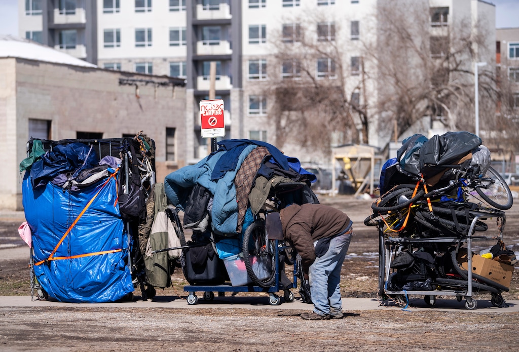 (Rick Egan | The Salt Lake Tribune)  Groups of unsheltered people move their belongings after the abatement from 500 West earlier in the day, on Thursday, March 2, 2023. Utah's annual homelessness report, released on June 29, 2023,  found a 10% increase in people newly homeless during fiscal year 2022.