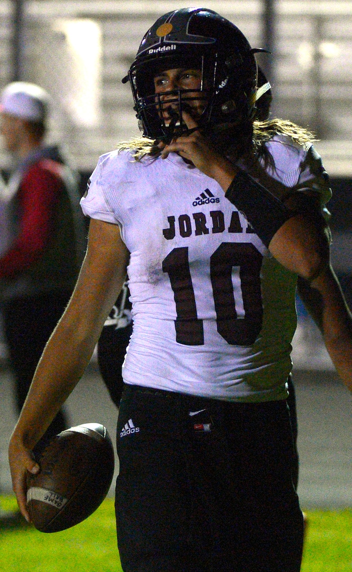 Leah Hogsten  |  The Salt Lake TribuneJordan quarterback Crew Wakley with the 4-yard touchdown run. Jordan High School defeated West Jordan High School football team 41-35 in their Region 3 football game, September 30, 2016. 