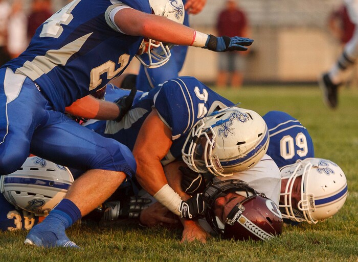 (Trent Nelson  |  The Salt Lake Tribune)  The Fremont defense tackles Jordan quarterback Austin Kafentzis as Fremont hosts Jordan High School football in Ogden, Utah Friday, August 17, 2012.