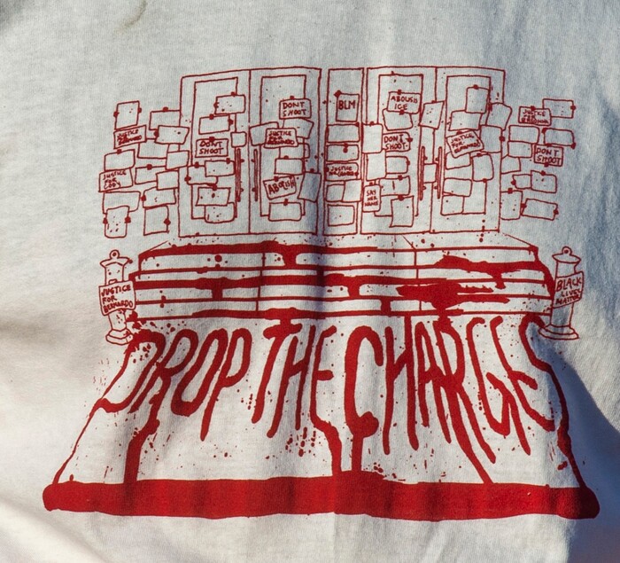 (Rick Egan  |  The Salt Lake Tribune)   Drop The Charges t-shirts were worn by several dozen protesters as they danced in the streets of Salt Lake City, during the Dance Dance Revolution protest for racial equality, on Sunday, Aug. 9, 2020.