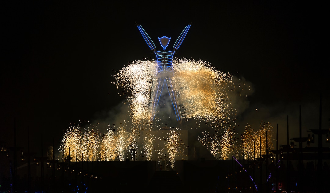 (Rick Egan  |  The Salt Lake Tribune)   Fireworks surround the man, at the the start of the burn, during Burning Man,during Burning Man, a week long celebration of art and radical self expression, in the Black Rock Desert in Nevada, Saturday, Sept. 1, 2018.