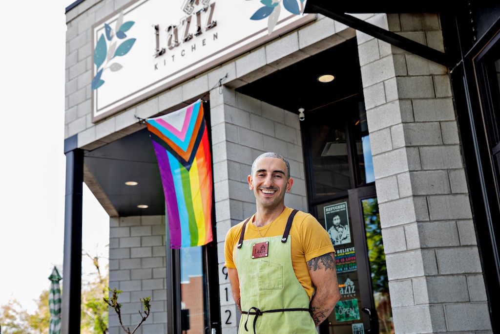 (Kim Raff | The New York Times) Moudy Sbeity, the founder of Laziz Kitchen in Salt Lake City, offers Middle Eastern food and a message “that we are inclusive in love,” on April 30, 2021. Laziz Kitchen is one of several newer restaurants that cultivate a wide spectrum of LGBTQ customers, as symbolized by the redesigned version of the traditional rainbow flag out front.