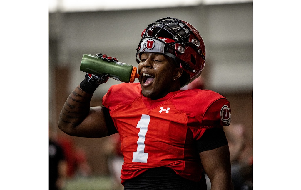 (University of Utah) Running back Jaylon Glover takes a water break between drills during a recent spring practice.