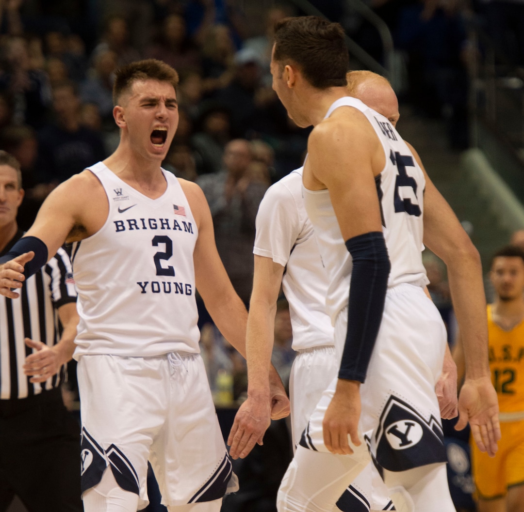 (Rick Egan  |  The Salt Lake Tribune)      Brigham Young guard Zac Seljaas (2) and  forward Gavin Baxter (25) celebrate a big Cougar lead with 10 minutes left in the game, in WCC basketball action between Brigham Young Cougars and San Francisco Dons, at the Marriott  Center, Thursday, February 21, 2018.