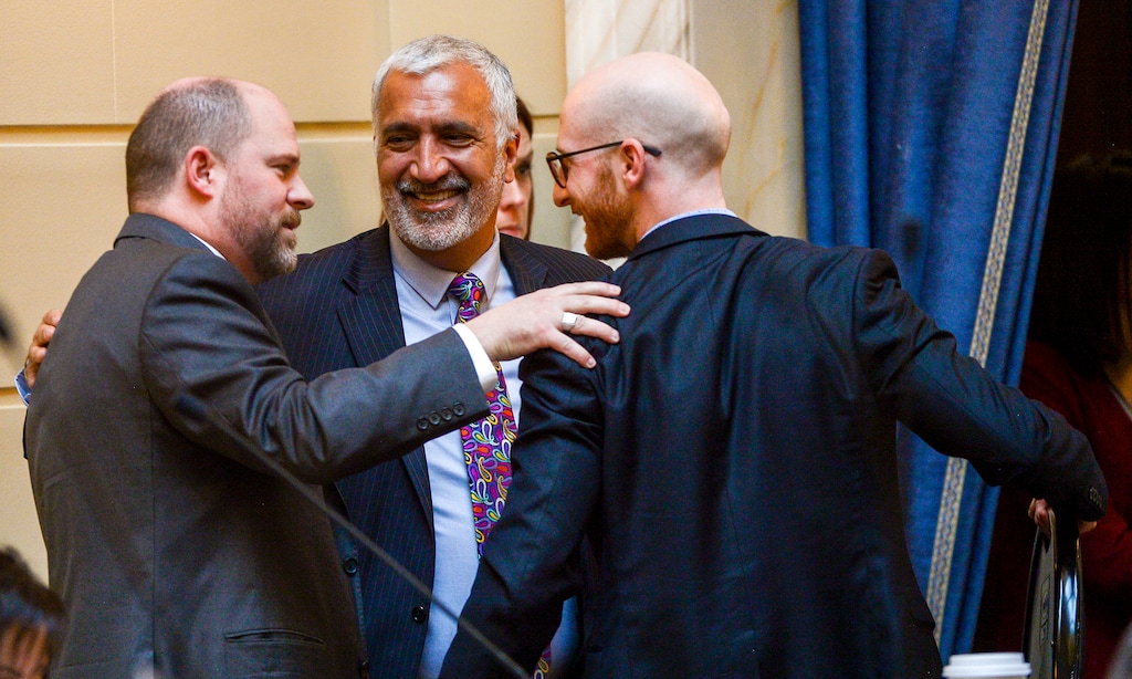 Leah Hogsten  |  The Salt Lake Tribune   l-r Daniel Thatcher, R- West Valley City, celebrates the initial approval of his hate crimes bill with Salt Lake County District Attorney Sim Gill and Sen. Derek Kitchen, D-Salt Lake City. Thatcher's SB103 bill would allow judges to increase penalties for a crime if a defendant is convicted of targeting someone based on ancestry, disability, ethnicity, gender identity, national origin, race, religion or sexual orientation. A person must first be convicted of a crime before additional penalties would apply. There have been no successful convictions under the state's current hate crimes law.