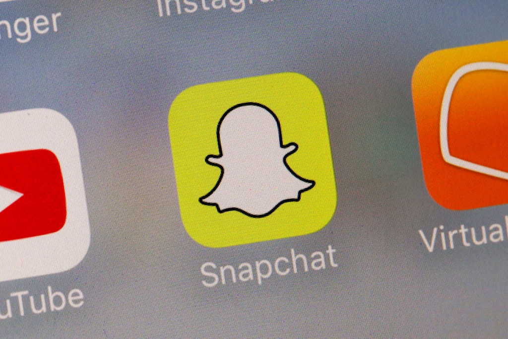 (Richard Drew | The Associated Press) This Wednesday, Aug. 9, 2017, photo shows the Snapchat app. Snap Inc. reports earnings, Tuesday, Nov. 7, 2017.