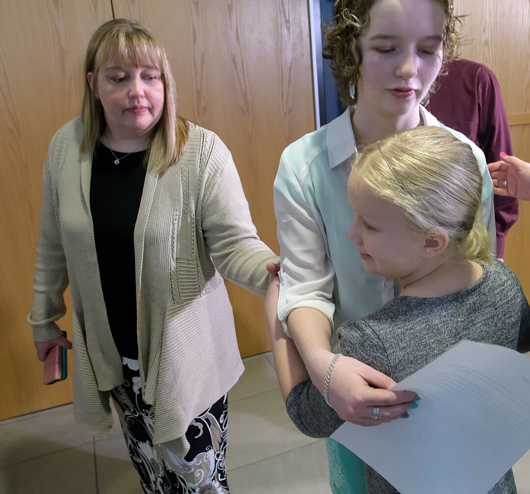(Eli Lucero  |  Pool Photo)  Deserae Turner hugs her younger sister KC Turner as her mother April Turner watches, following Jayzon Decker's sentencing hearing for attempted aggravated murder and obstructing justice, Wednesday, Feb. 7, 2018, in Logan, Utah. Decker received a sentence of 15 years to life for planning and being present at the shooting of Deserae Turner in February 2017, and leaving her for dead in a dry irrigation canal in Smithfield, Utah.