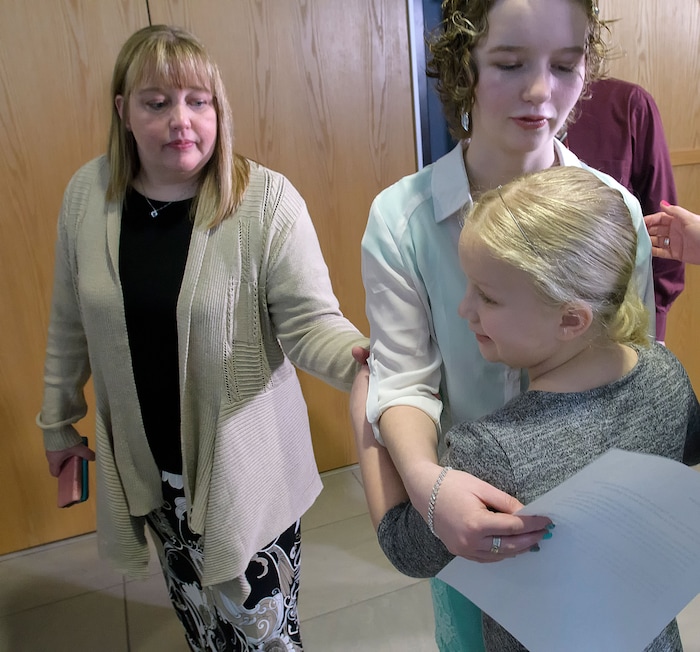 (Eli Lucero  |  Pool Photo)  Deserae Turner hugs her younger sister KC Turner as her mother April Turner watches, following Jayzon Decker's sentencing hearing for attempted aggravated murder and obstructing justice, Wednesday, Feb. 7, 2018, in Logan, Utah. Decker received a sentence of 15 years to life for planning and being present at the shooting of Deserae Turner in February 2017, and leaving her for dead in a dry irrigation canal in Smithfield, Utah.