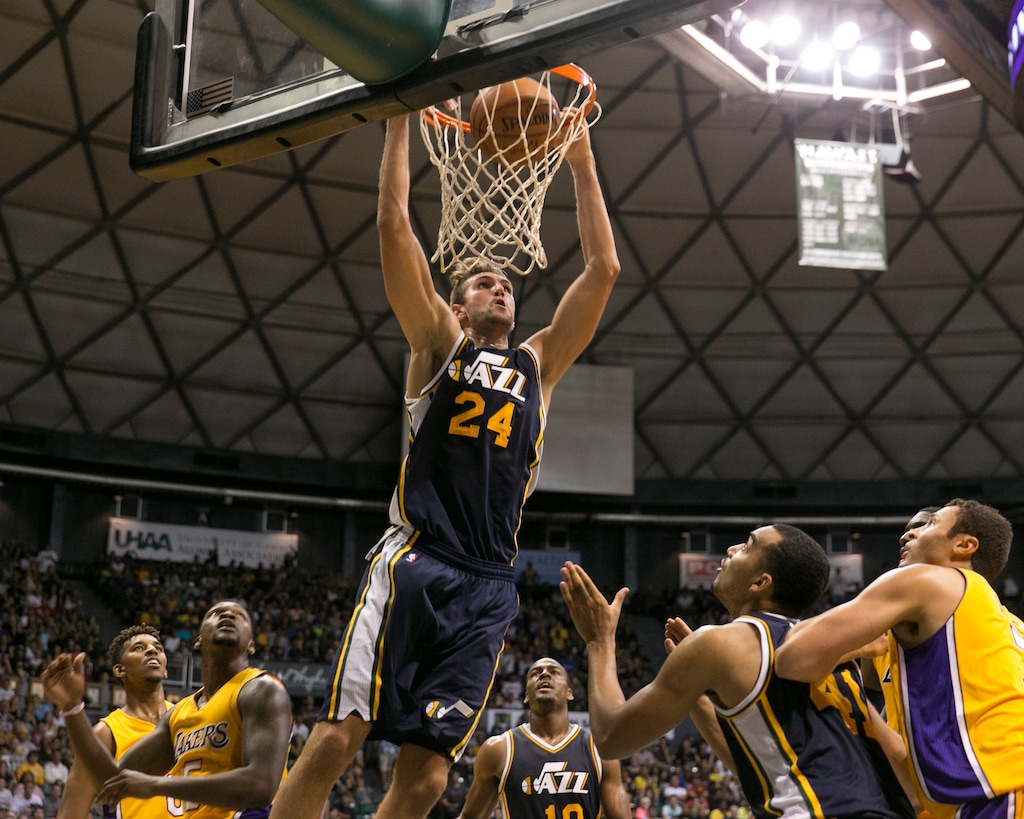 Utah Jazz center Jeff Withey (24) makes a basket over the Los Angeles Lakers during the second half of an NBA preseason basketball game, Tuesday, Oct. 6, 2015, in Honolulu.  The Jazz defeated the Lakers 117-114.  (AP Photo/Marco Garcia)
