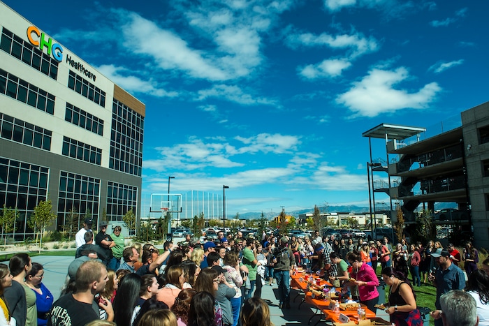 (Chris Detrick | The Salt Lake Tribune) Employees compete in a pizza eating competition during a fundraiser for United Way at CHG Healthcare Wednesday, September 20, 2017.