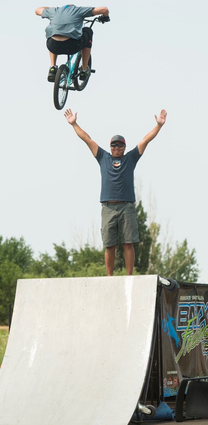 (Rick Egan  |  The Salt Lake Tribune)    Justin McCarty jumps over Souri Bouaphafeuth of Layton, during the BMX Stunt Show, at the Davis County Fair in Farmington, Saturday, Aug. 18, 2018.