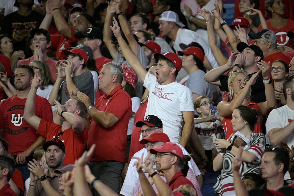 (Phelan M. Ebenhack | AP) Utah fans cheer in the stands during the second half of an NCAA college football game against Florida, Saturday, Sept. 3, 2022, in Gainesville, Fla.